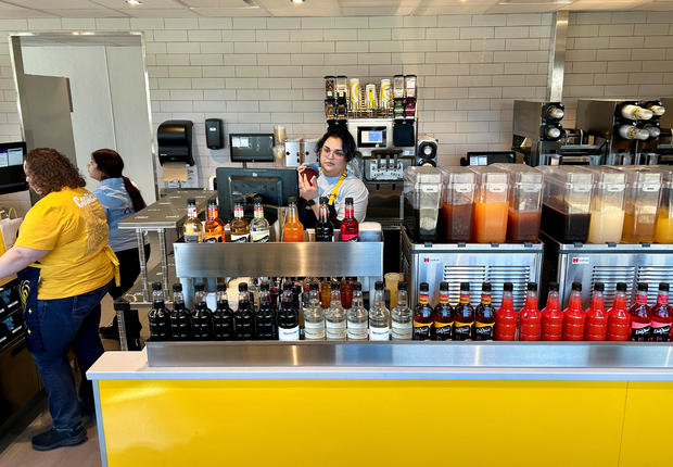 Employees work at McDonald’s new beverage-led, drive-thru only chain, CosMc’s, during the concept’s secret opening in Bolingbrook 