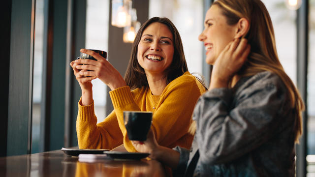 Friends meeting in coffee shop on a weekend 