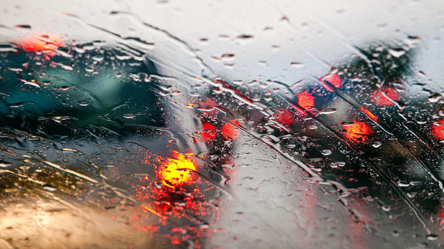 Car windshield in traffic jam during rain 
